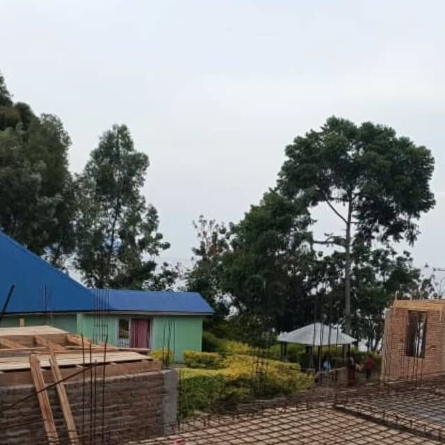 The new hospital wing under construction beside the existing building
