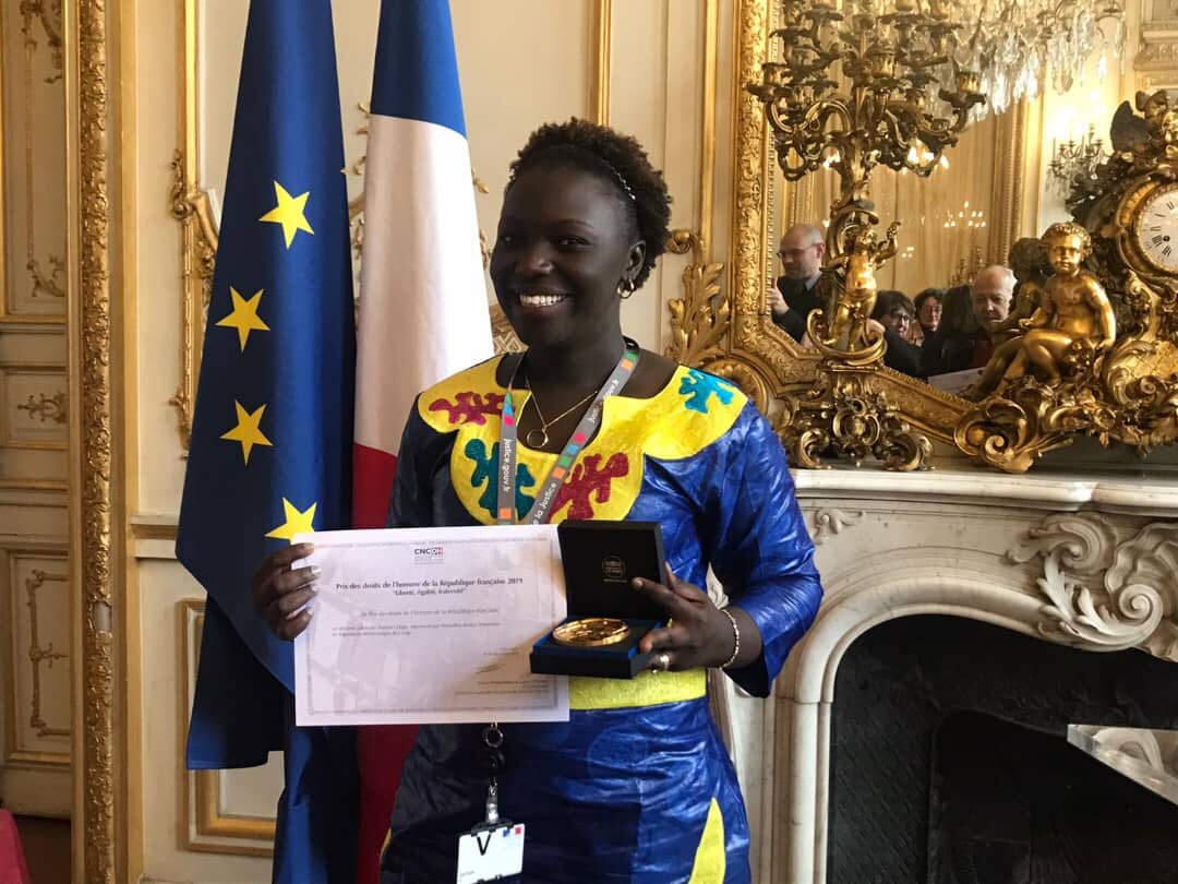 Marcelline Budza receiving the French Republic Human Rights Prize in Paris, December 2019